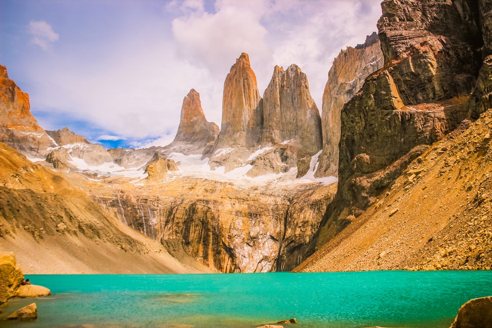 a mountain range with a lake in the foreground