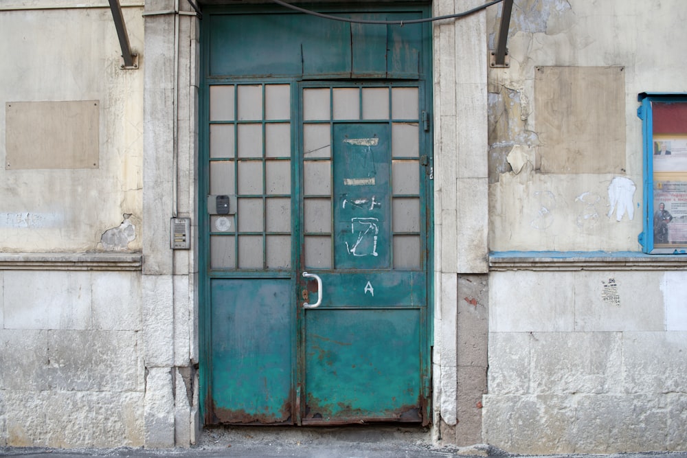 a blue door is open on a building