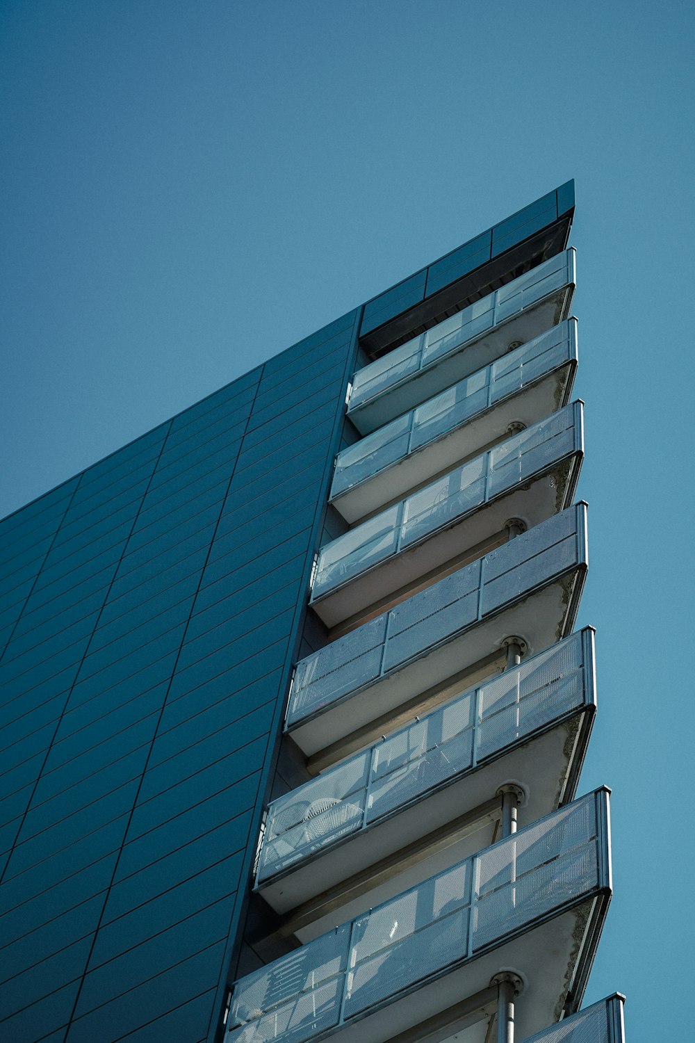 a very tall building with a clock on it's side