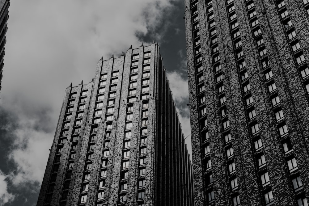 a black and white photo of two tall buildings