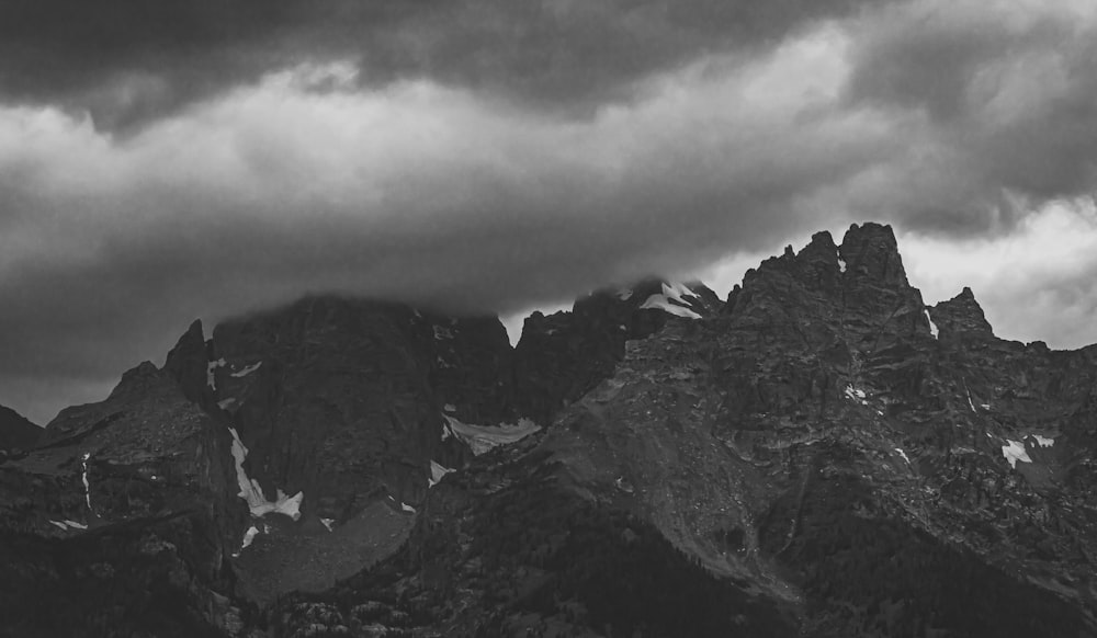 a black and white photo of a mountain range