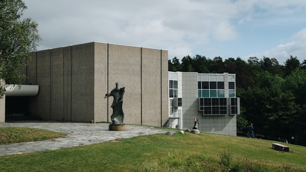 a large building with a statue in front of it