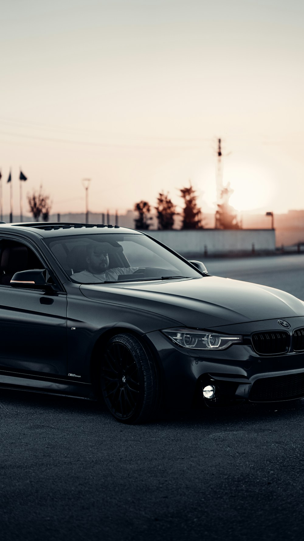 a black car parked in a parking lot