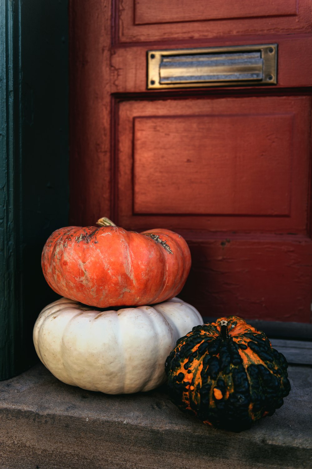 a couple of pumpkins sitting on top of each other