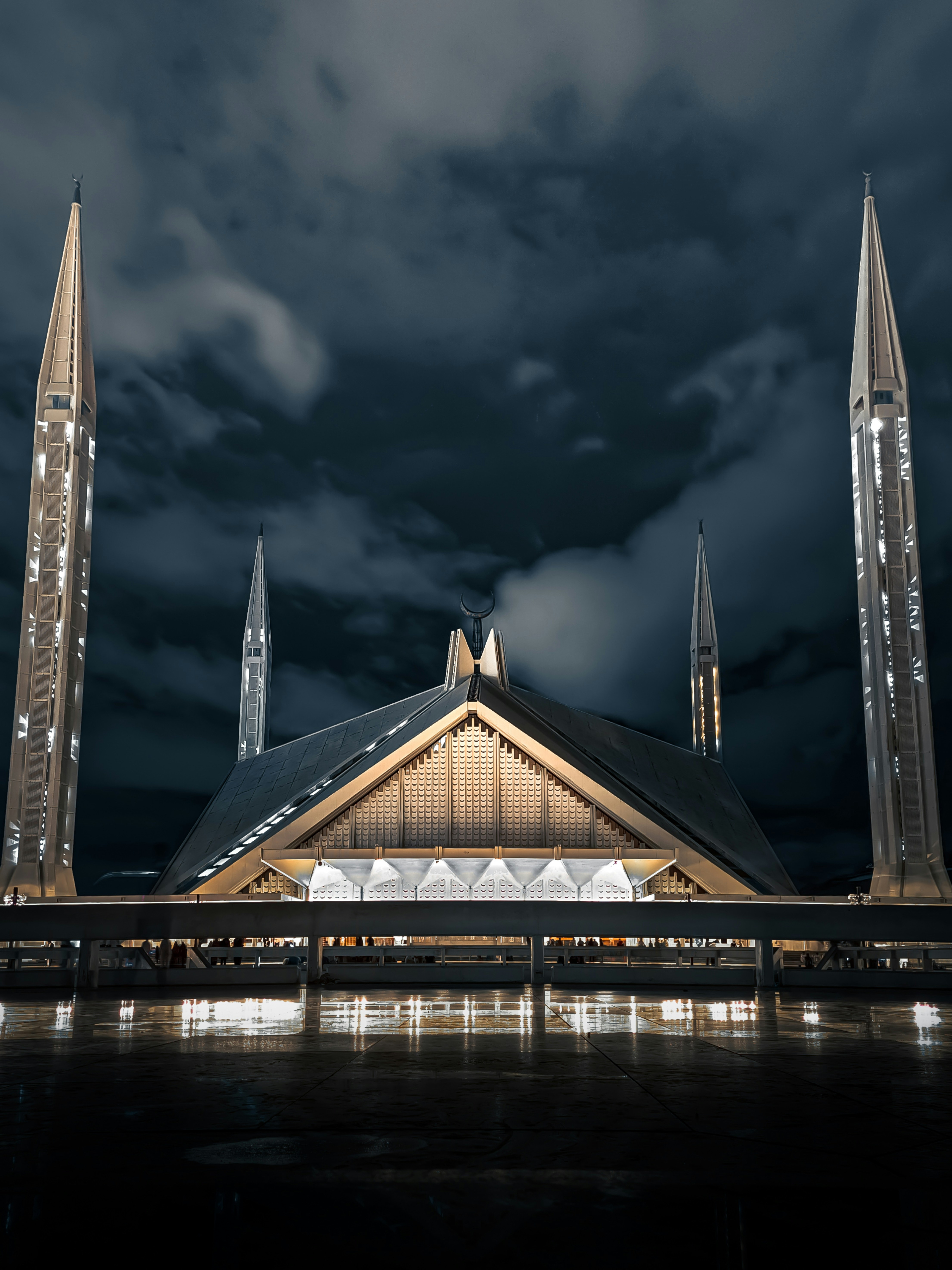 The beautiful Shah Faisal Mosque illuminating under the night sky- Islamabad,Pakistan