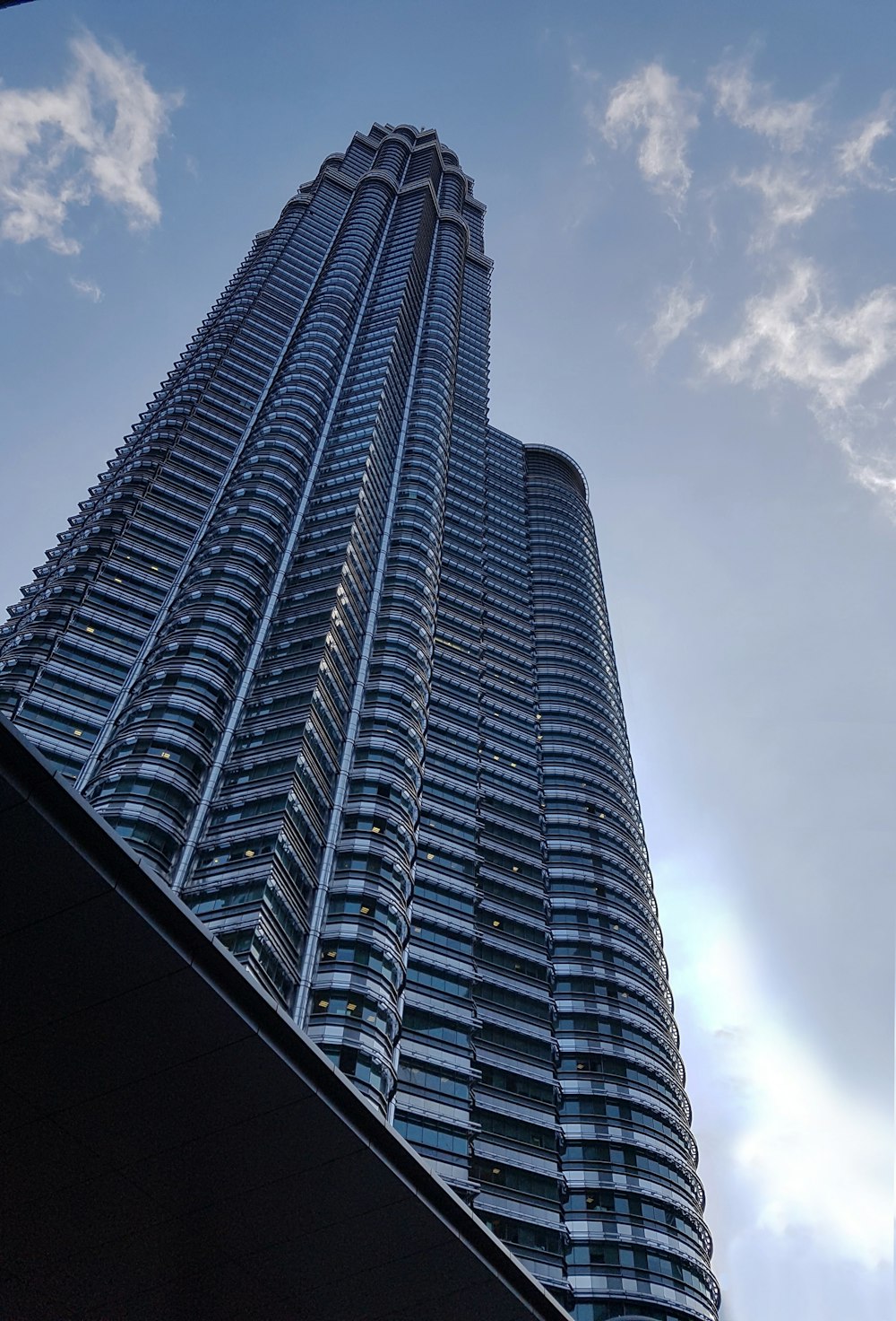 a very tall building with a sky background