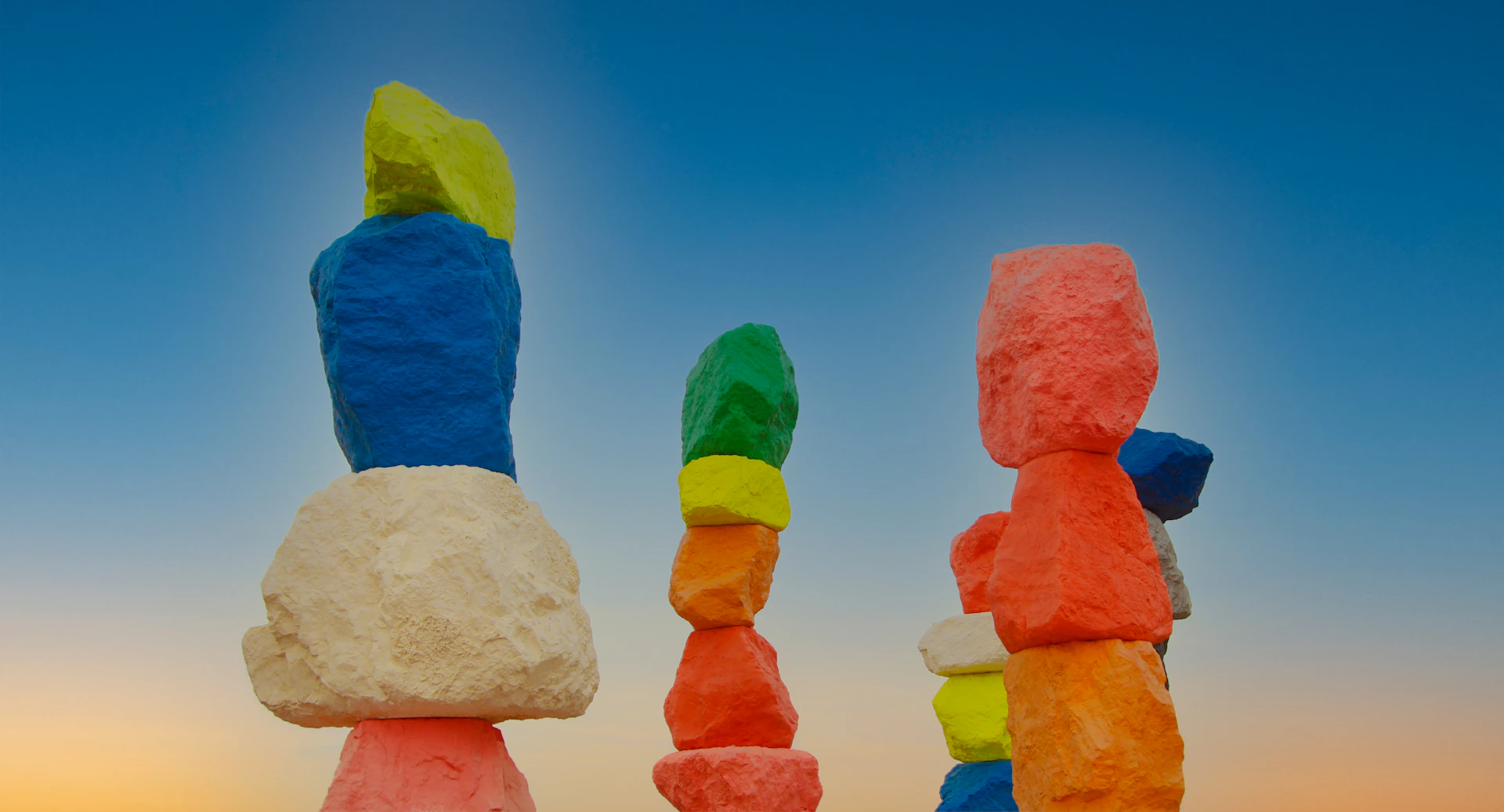 a group of colorful rocks sitting next to each other