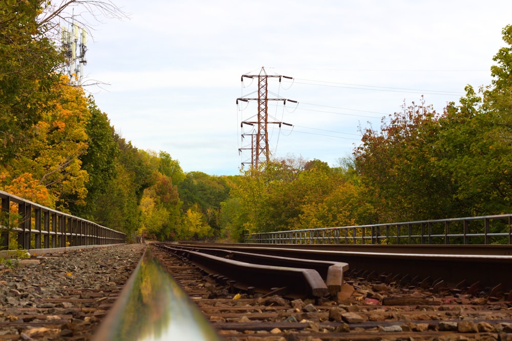 a train track with trees in the background