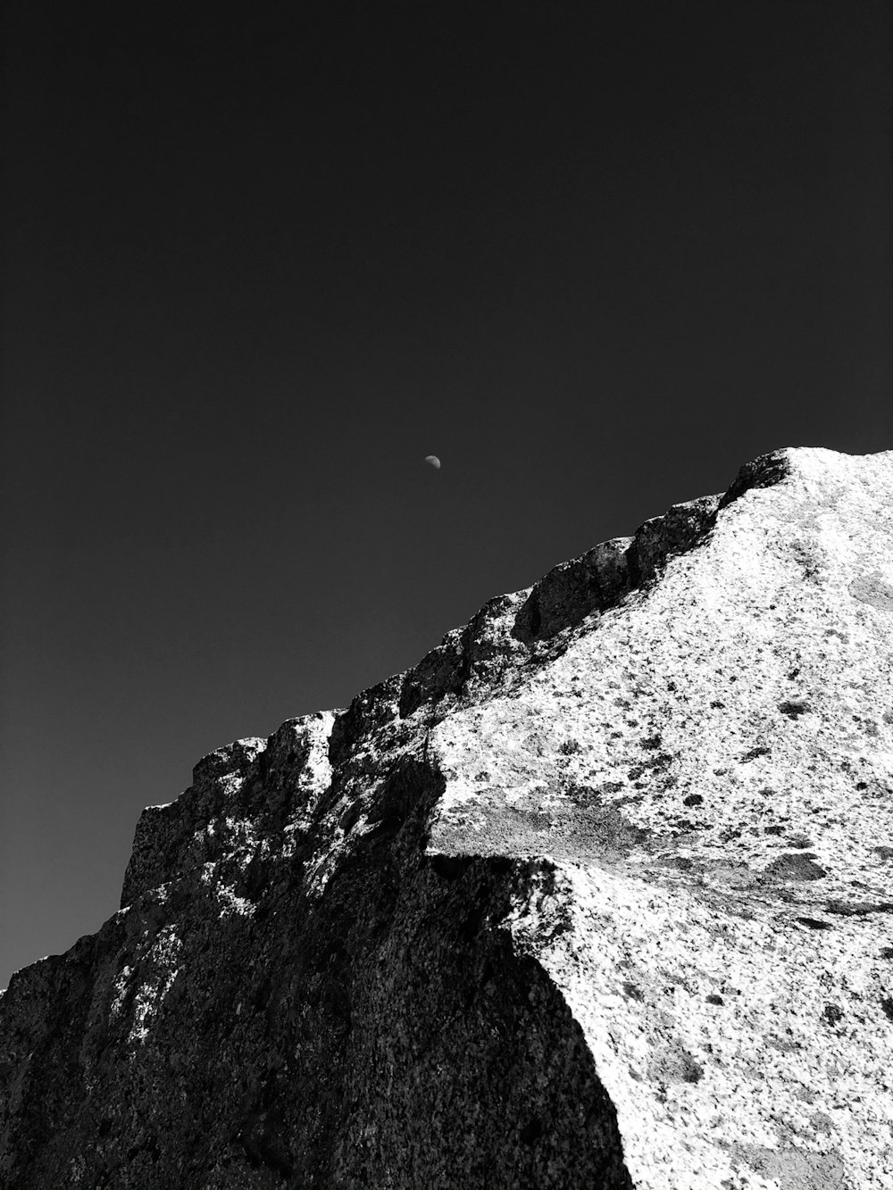 a black and white photo of a mountain