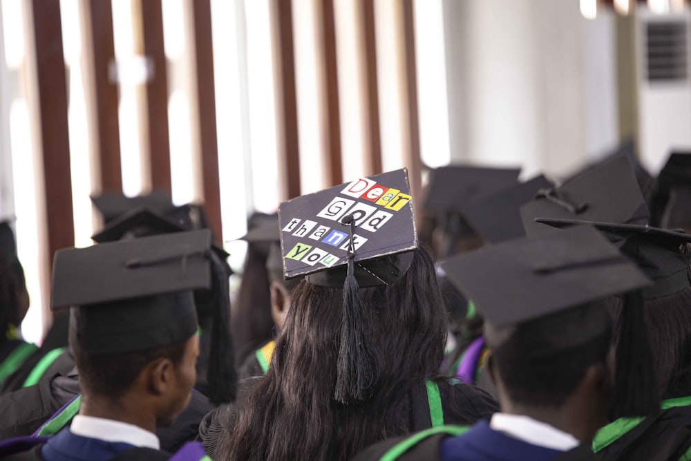 a group of graduates wearing graduation caps and gowns