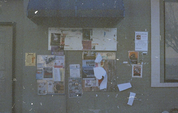 A welcoming community center entrance with a bulletin board displaying local event flyers.