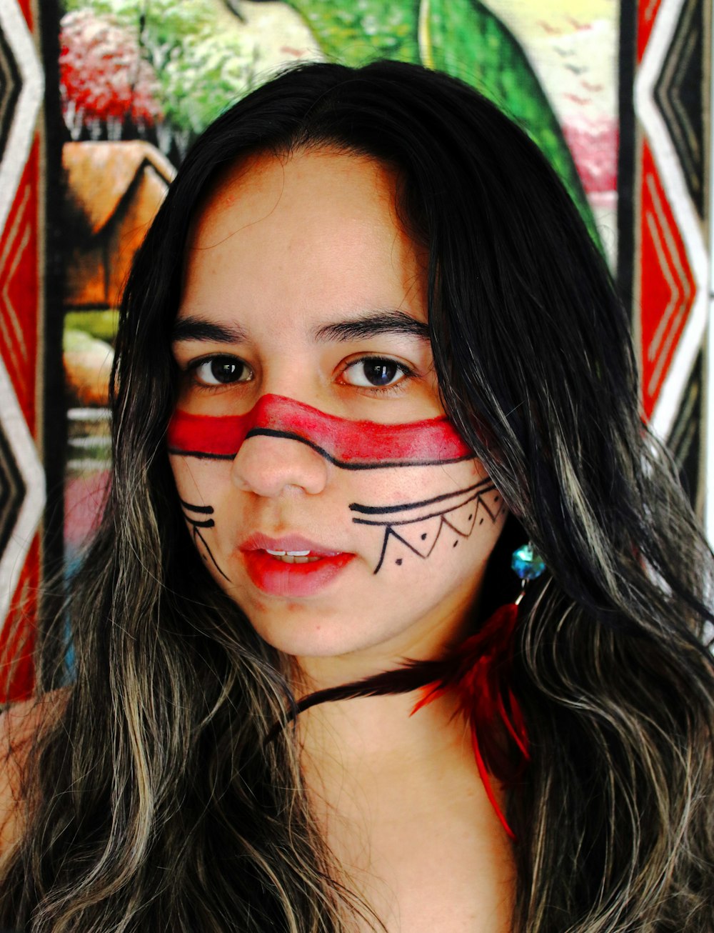 a woman with a painted face is posing for a picture