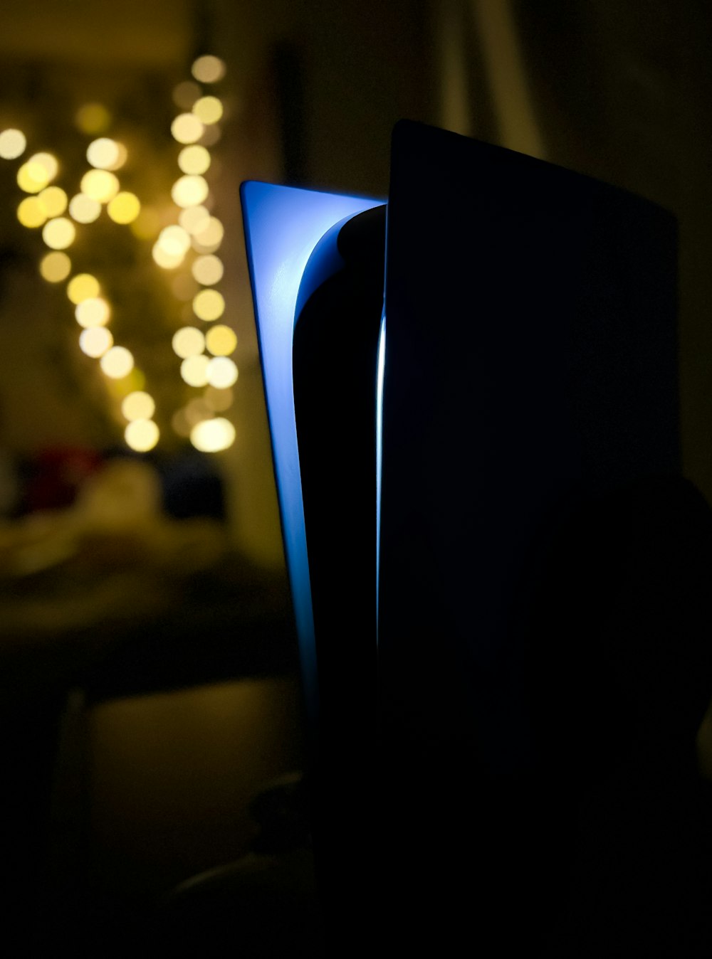 a close up of a blue light in a dark room