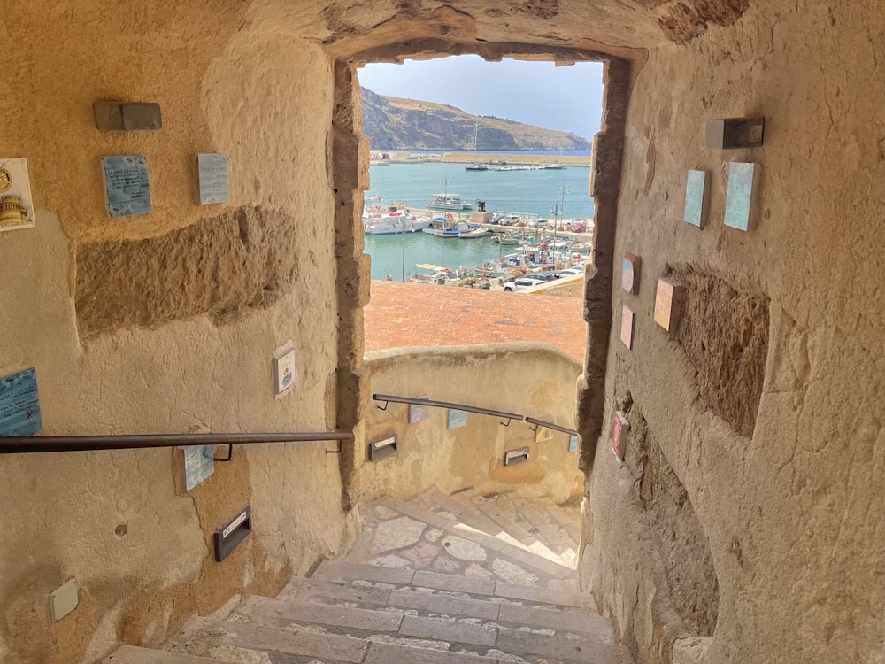 a stairway leading to a harbor with boats in the water