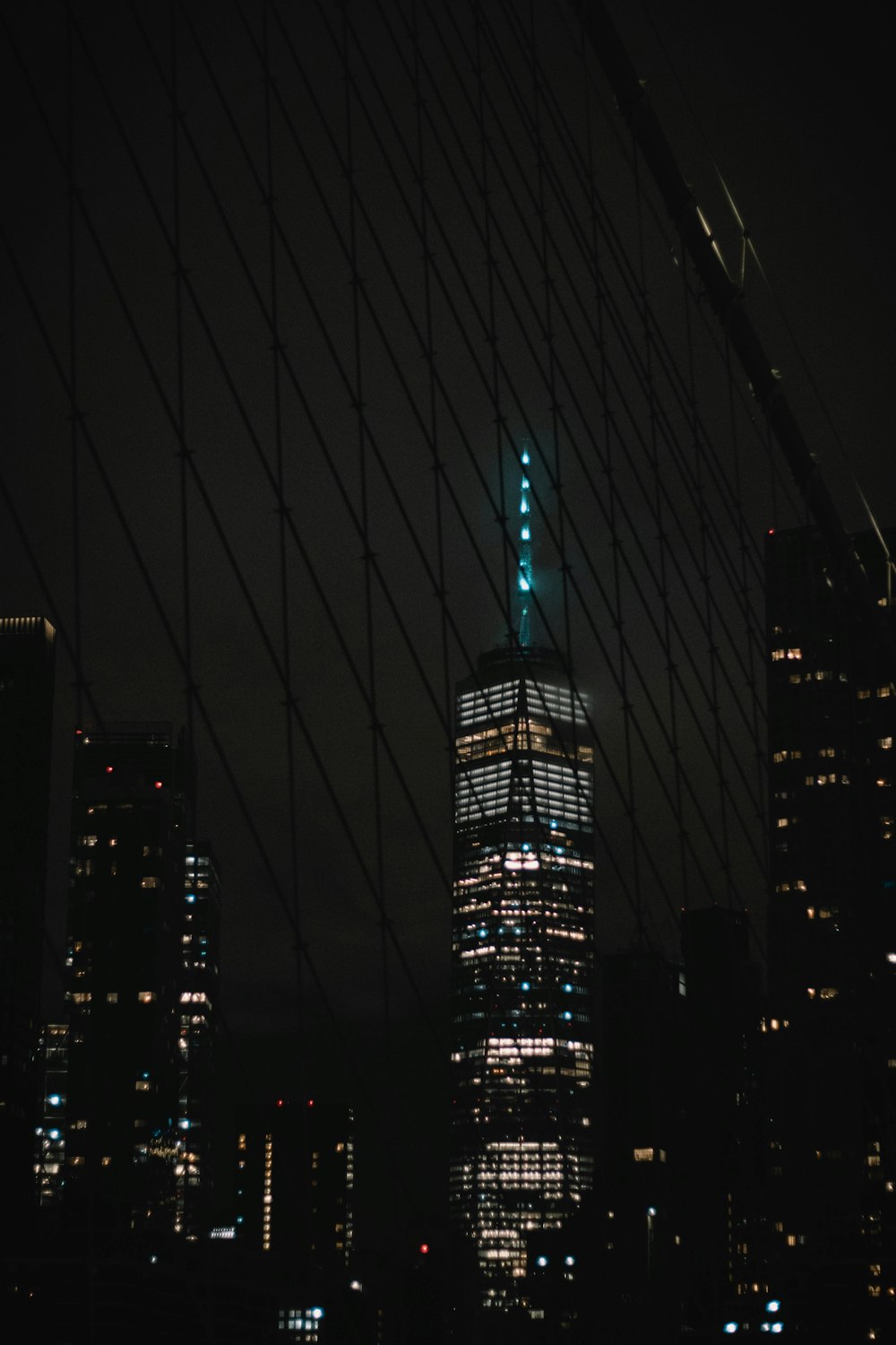 a very tall building in the middle of a city at night