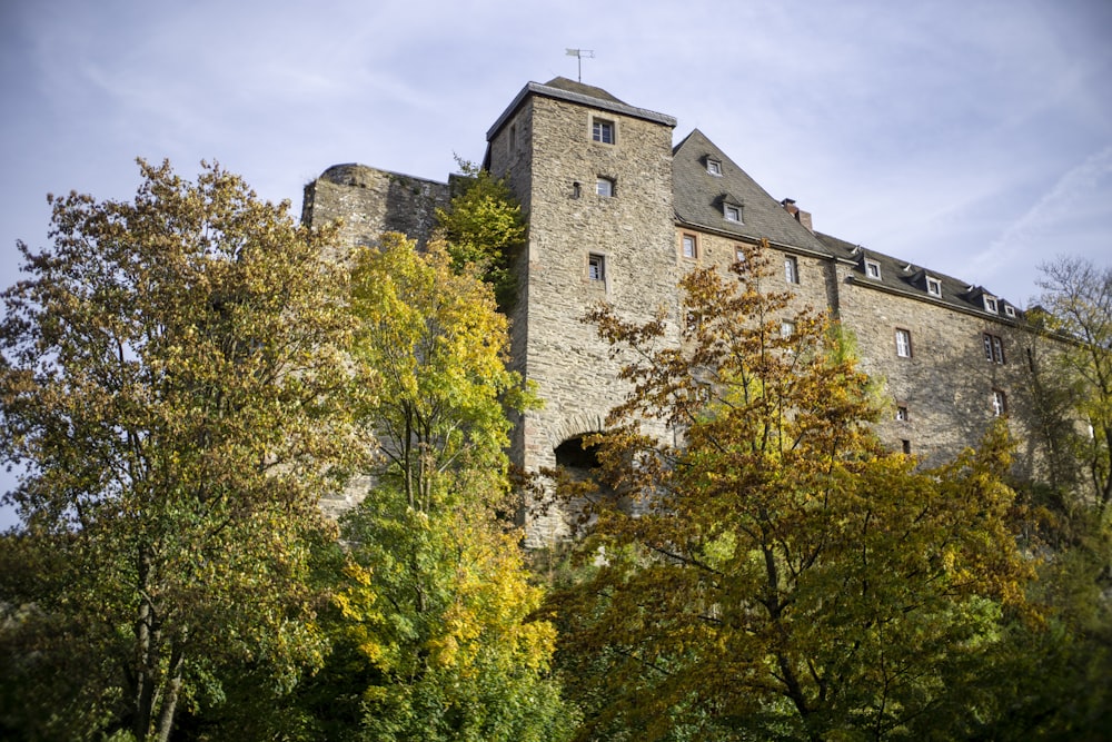 a tall castle with a clock on the top of it