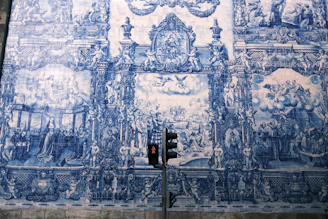 A lively street art piece combining traditional Portuguese patterns with modern themes.