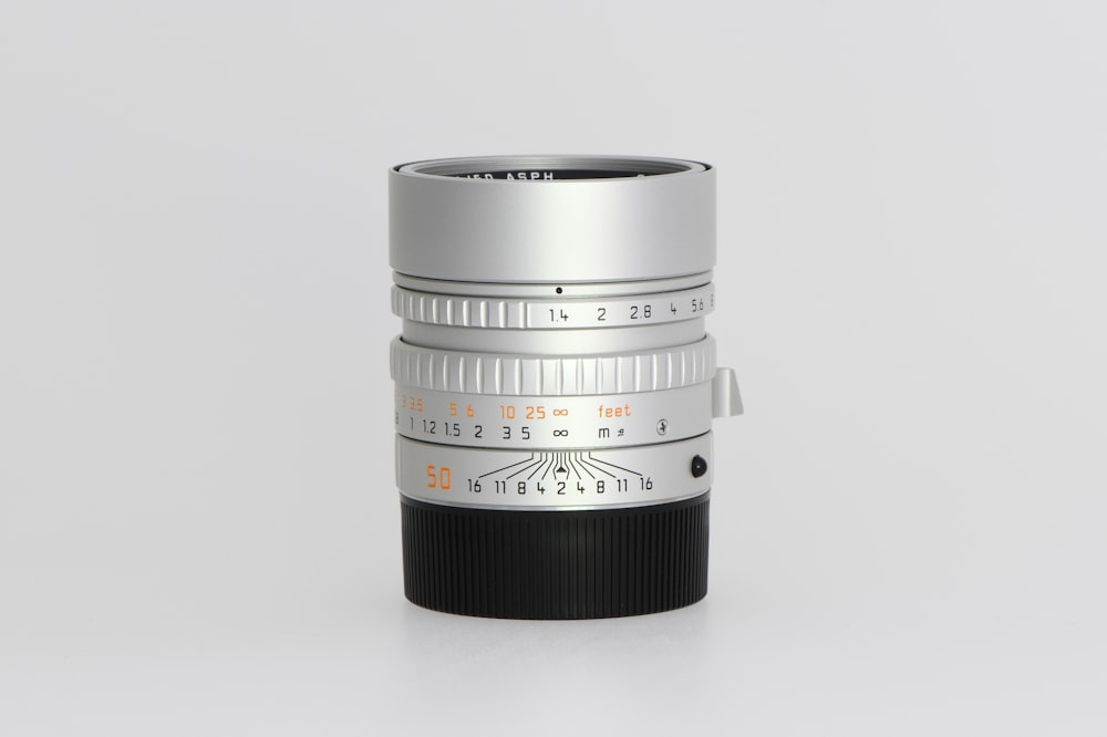 a close up of a camera lens on a white surface