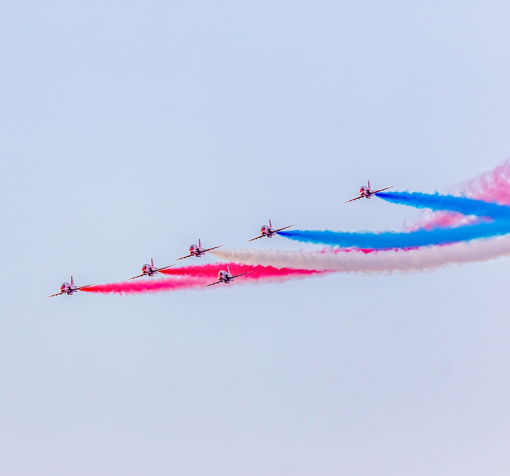 a group of airplanes flying in formation in the sky