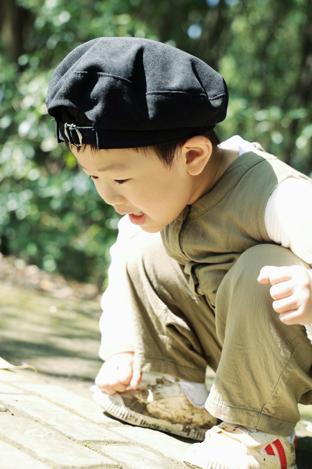 a little boy wearing a hat