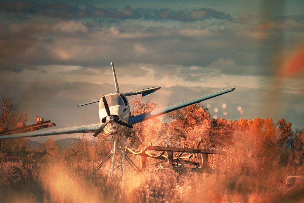 a plane is flying low over a field