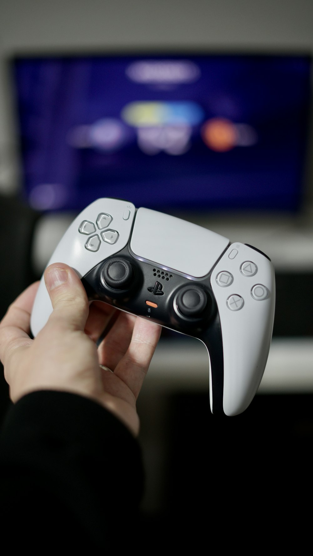 a person holding a video game controller in their hand