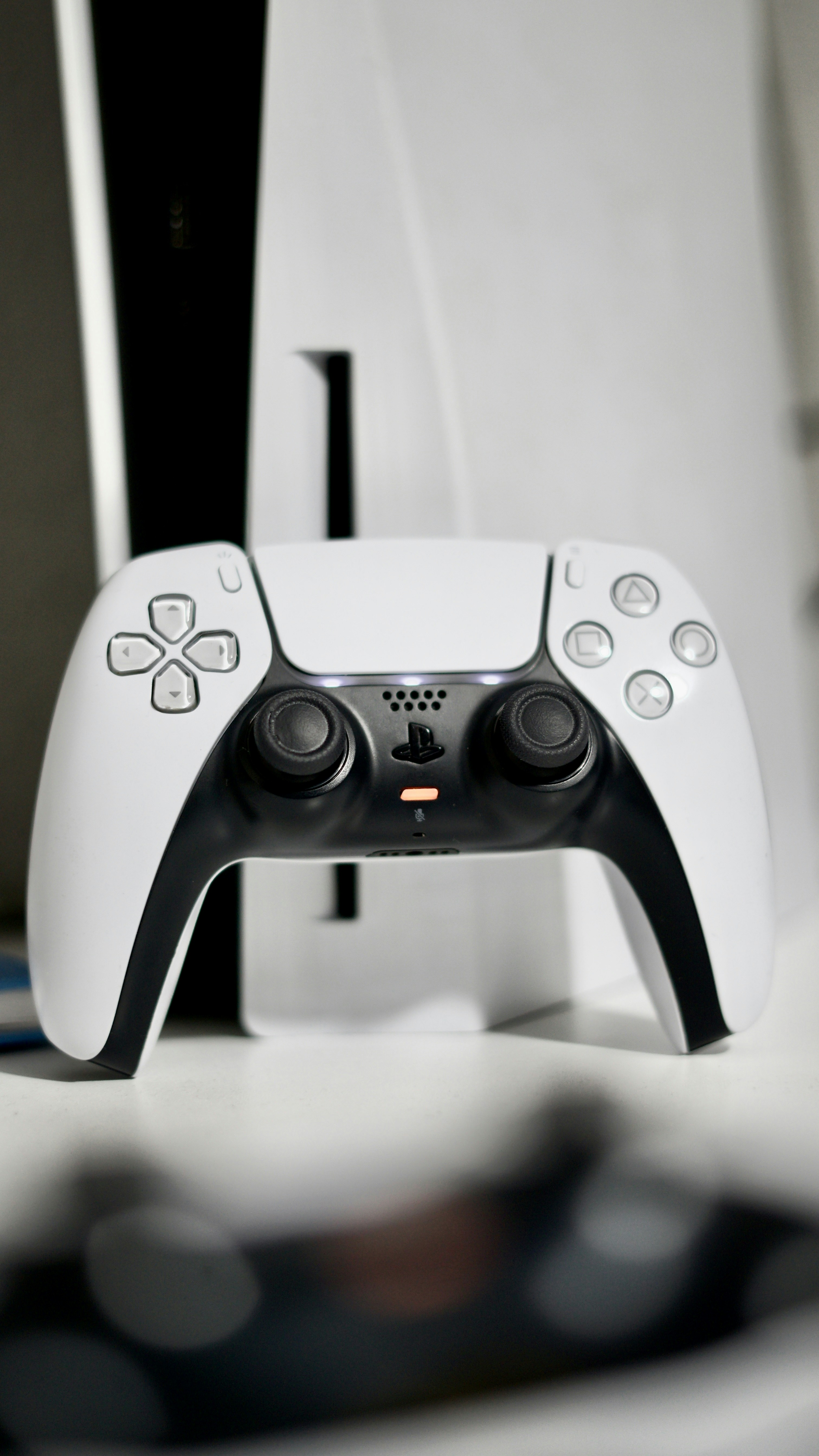 White PS5 DualSense controller on white background, bright clean product photo