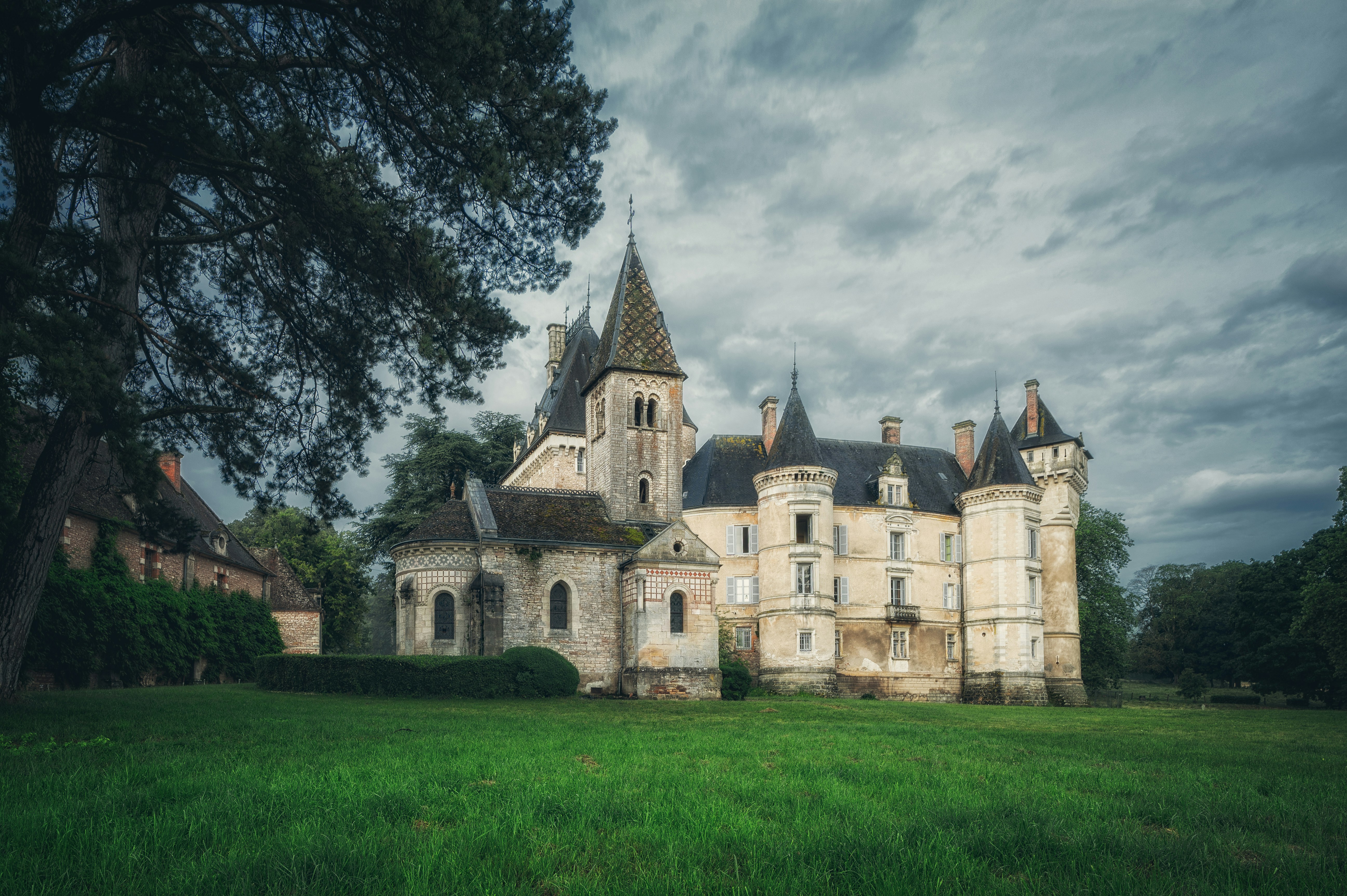 a castle on top of a grass covered field