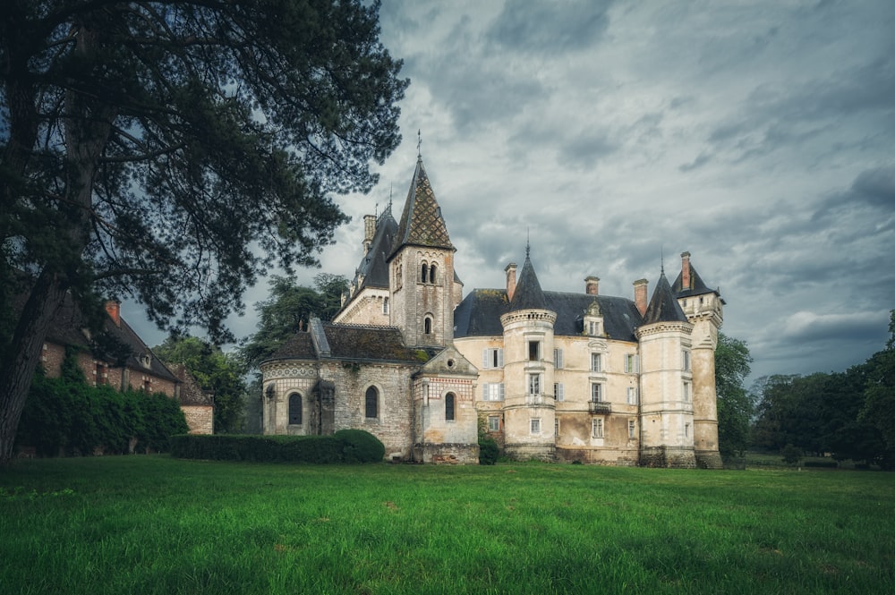 a castle on top of a grass covered field