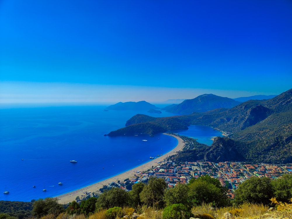 a view of a beach and a city from a hill