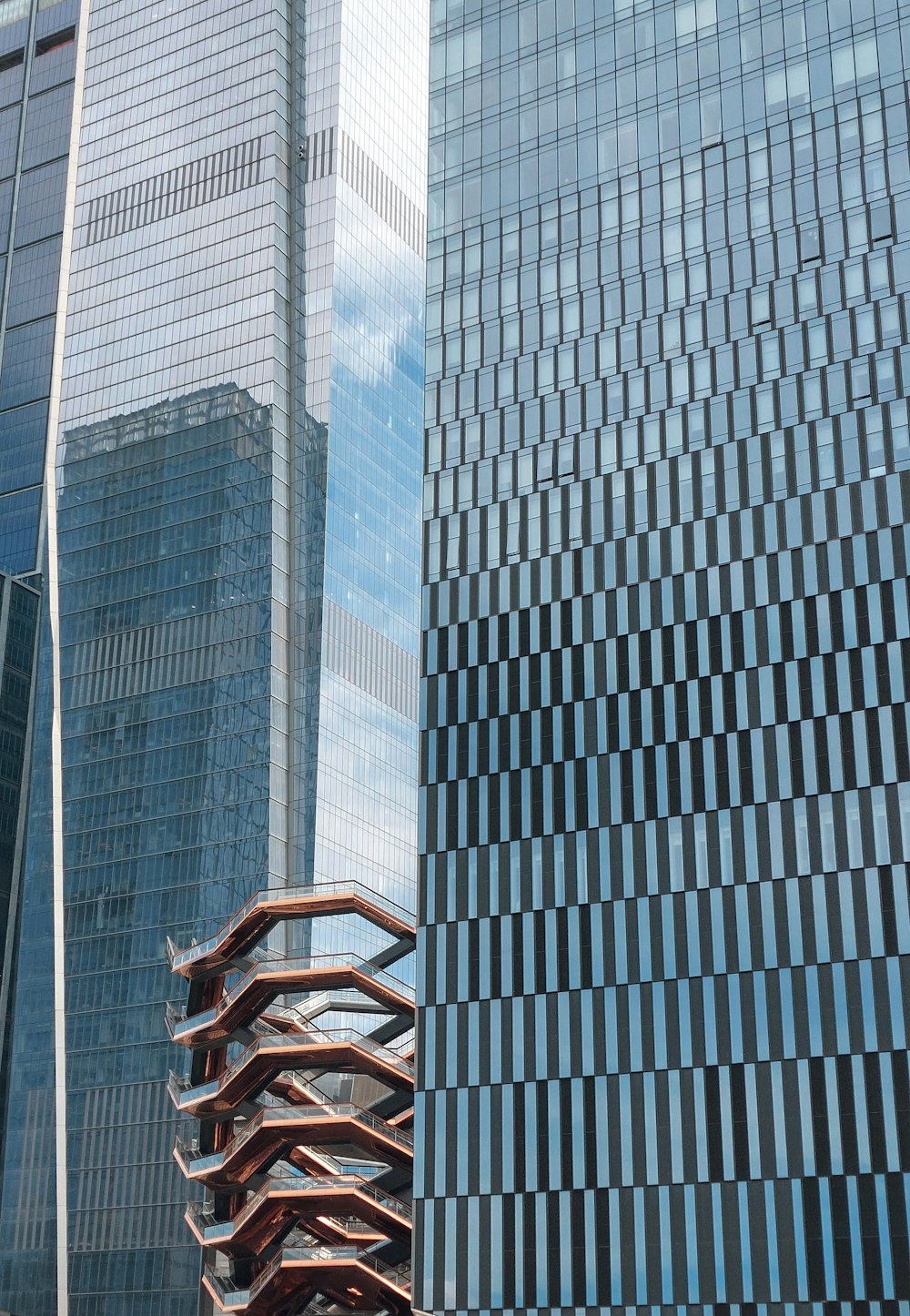 a tall building next to a very tall building