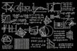 Bright educational posters featuring algebra formulas and visual aids on a classroom wall.