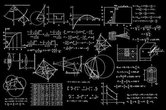 A collection of complex mathematical diagrams and equations displayed on a blackboard-like background. Various geometric shapes, graphs, and physics formulas are intricately detailed, showing a range of mathematical concepts from calculus to geometry and trigonometry.