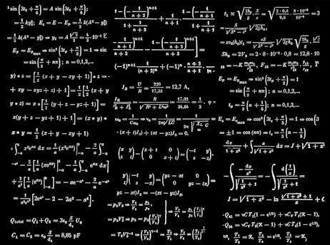 a black and white photo of a number of calculations