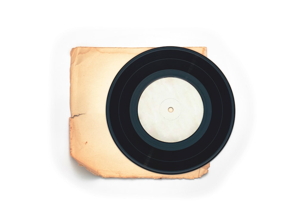 a record player sitting on top of a piece of paper