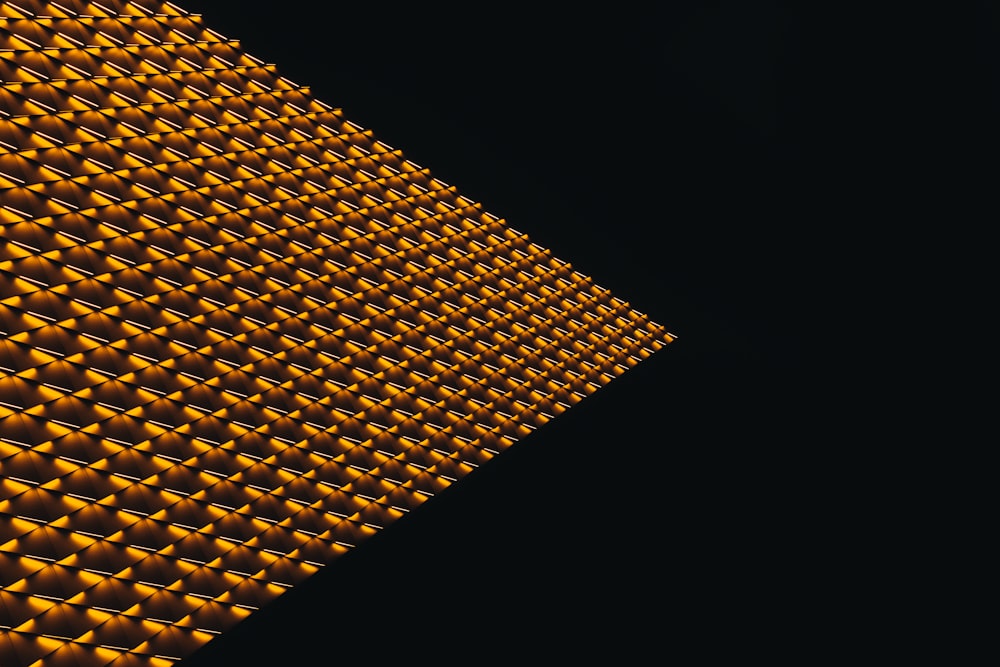 a close up of a yellow light on a black background