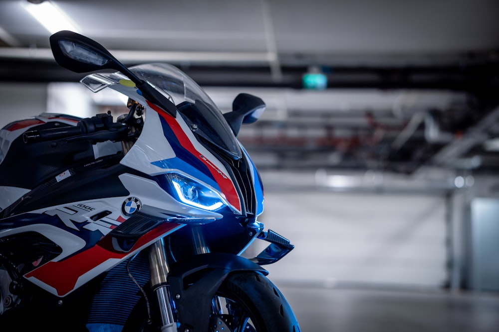 a close up of a motorcycle parked in a parking garage