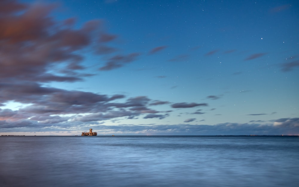 a long exposure of a lighthouse in the distance