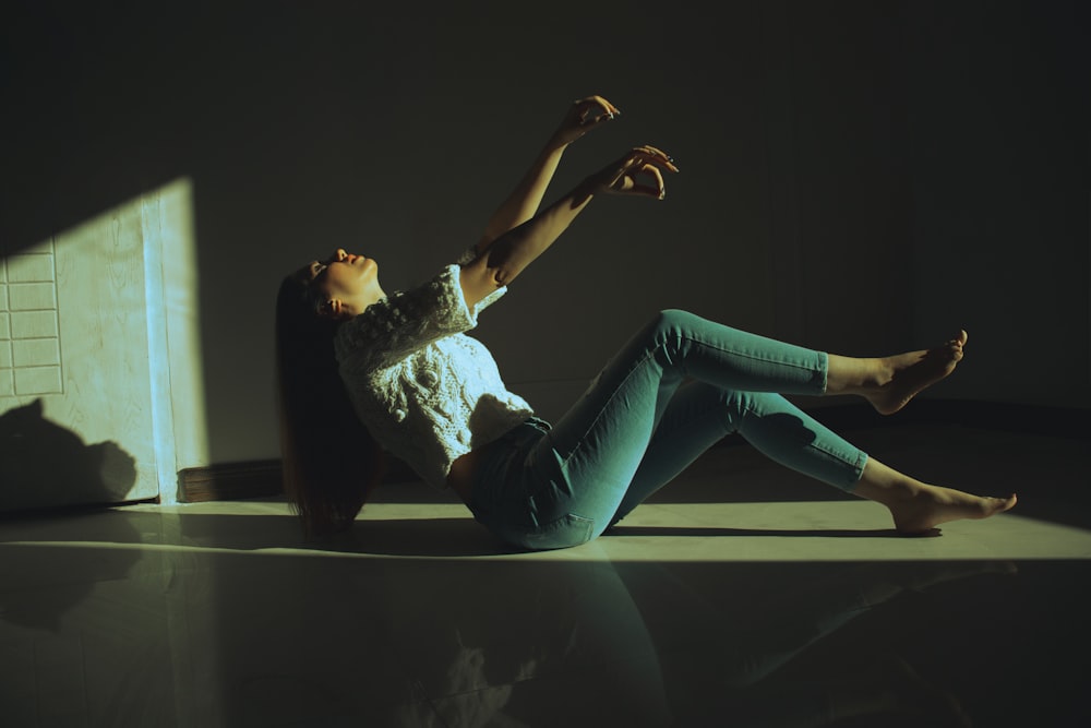 a woman laying on the floor in a room