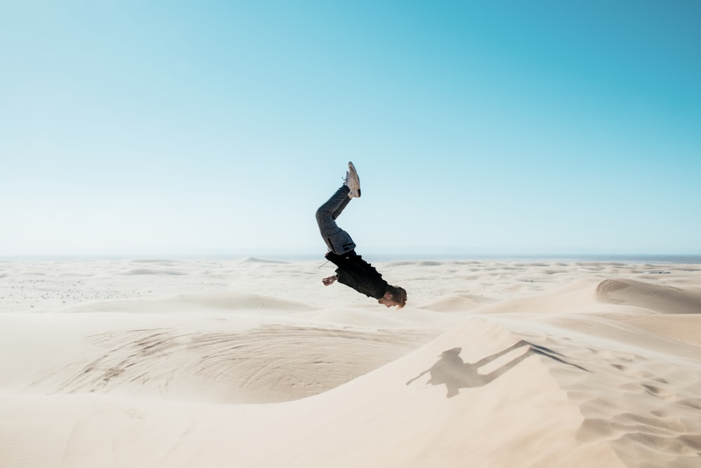 a man flying through the air while riding a skateboard