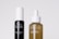 Two skincare bottles are positioned side by side against a plain background. The black bottle on the left is labeled 'Mito Special' and described as a cell booster. The brown bottle on the right, labeled 'Cells Life', features a dropper cap and is described as a repairing concentrate.