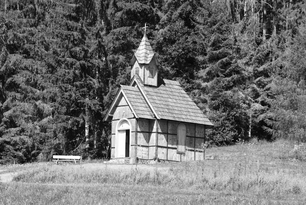 a black and white photo of a small church