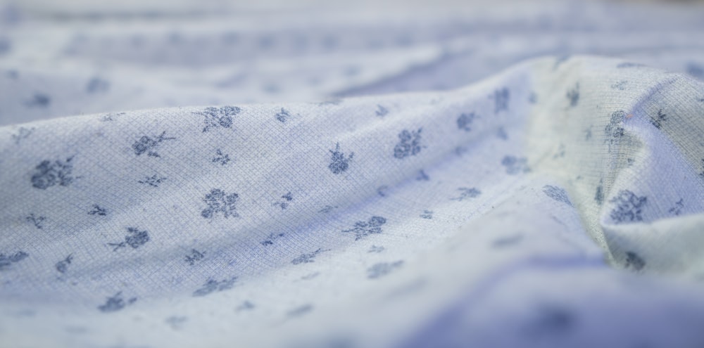 a close up of a blue and white blanket