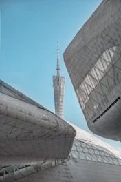 a very tall building with a very tall tower in the background