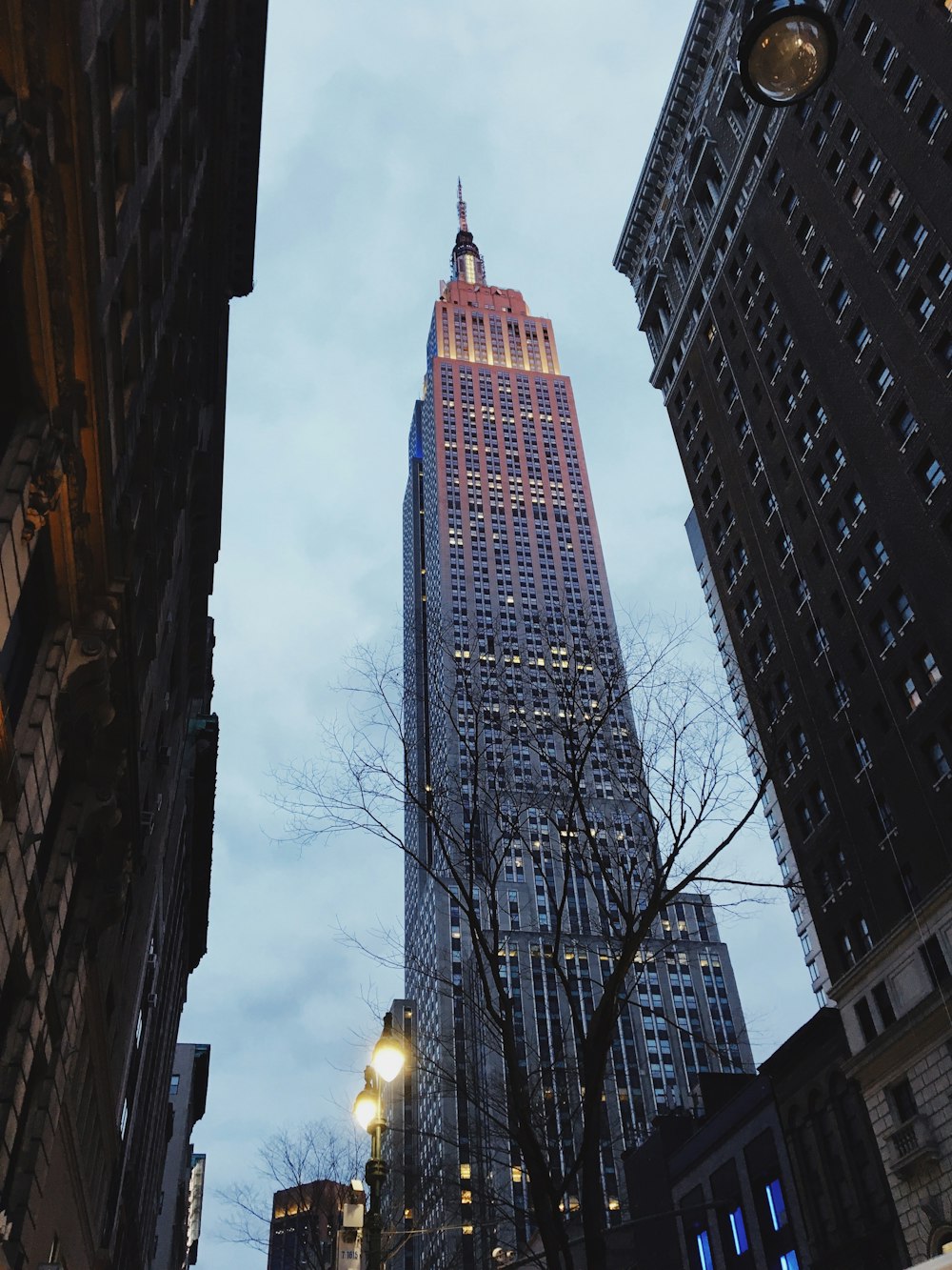 a very tall building towering over a city