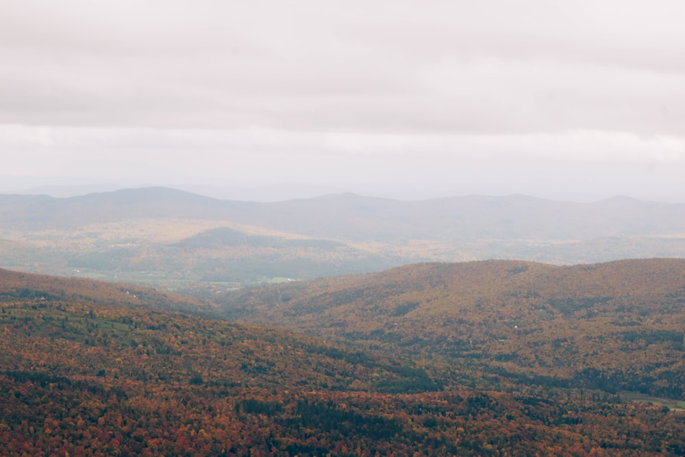 a scenic view of a mountain range in the fall