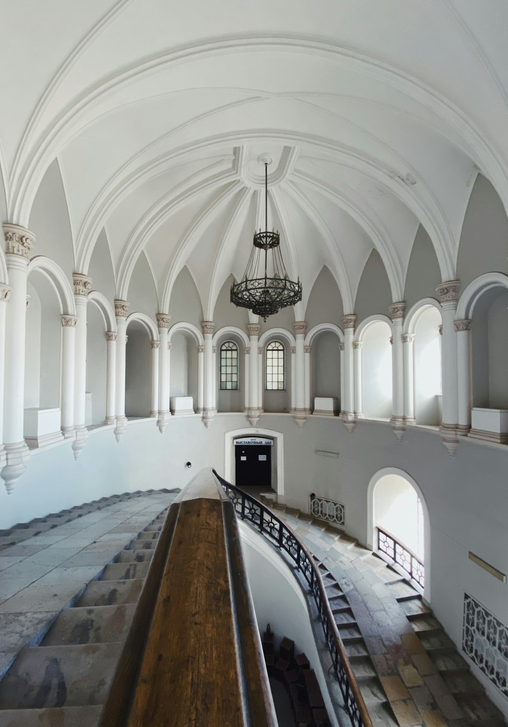 a large room with a chandelier hanging from the ceiling