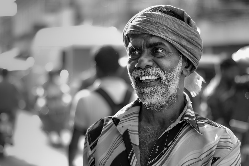 a black and white photo of a man wearing a turban