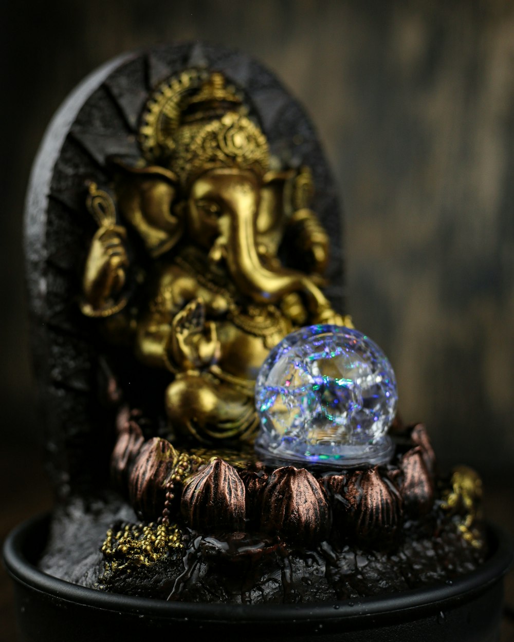 a crystal ball sitting on top of a statue