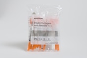 a package of needles with needles inside of it
